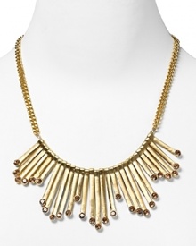 Strike gold with this plated bib necklace from Aqua, accented by angular bars and inset blush crystals. It's neo-tribal look demands to be worn with bold colors and prints.