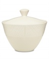 Sleek and simple in solid cream stoneware, the White Pepper covered sugar bowl provides contemporary style for casual dining with an intriguing pebbled texture, smooth body and lid. (Clearance)