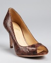 A classic shoe with a twist. A snake embossed design lends added appeal to the Cleas pumps from IVANKA TRUMP.