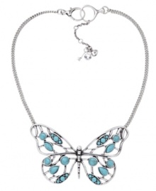 Spread your wings. Fossil's stylish large vintage openwork butterfly features resin and reconstituted turquoise, set in silver tone mixed metal. Approximate length: 13 inches + 2-inch extender. Approximate drop: 2-1/3 inches.