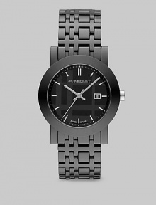 A sleek design with a black check etched dial. Quartz movement Water resistant to 5 ATM Round ion-plated stainless steel case, 34mm (1.3) Smooth bezel Black dial Bar hour markers Date display at 3 o'clock Second hand Ceramic check link bracelet, 18mm wide (0.7) Made in Switzerland 