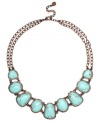 A style that will instantly remind you of summer. Monet's stunning collar necklace features a rich bronze tone mixed metal setting, which provides the perfect backdrop for bold reconstituted turquoise stones. Approximate length: 18 inches + 2-inch extender.