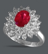 Royally stunning. Effy Collection's vibrant ring features an oval-cut ruby (1-9/10 ct. t.w.) surrounded by round-cut diamonds (1 ct. t.w.) and set in 14k white gold. Approximate diameter: 3/4 inch.