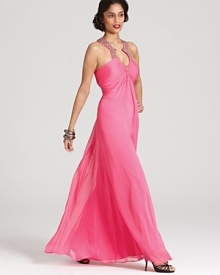 Boasting a vibrant shade, this Aidan Mattox gown is accented with a sparkling neckline for a glamorous finish.