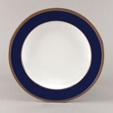 Embellished with intricate garlands, oval links and a fanciful dragon motif, this Wedgwood dinnerware evokes Europe's glorious Renaissance period. Rendered in deep blue and gold to transform any formal meal into a spectacular royal gala.