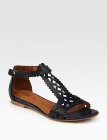 Scalloped leather t-strap has intricate cutout details and an adjustable ankle strap. Leather upperLeather lining and solePadded insoleMade in ItalyOUR FIT MODEL RECOMMENDS ordering one half size up as this style runs small. 