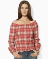 Lauren Jeans Co.'s soft woven cotton top channels western inspiration with a faded plaid pattern and smocked detailing.