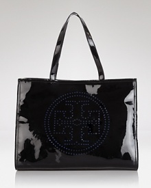 Tory Burch takes on-the-go accessorizing in an uptown direction with this glossy perforated tote, boasting a day-right look, sturdy trims, and room for all the essentials.