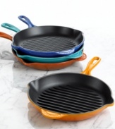 Great grilled flavor goes indoors with Le Creuset's versatile skillet grill, made with a ribbed base that adds traditional char lines to food and whisks fat and grease right away from food. The enameled cast iron construction produces extraordinary results on any kind of cooktop, getting hot fast and retaining heat efficiently. Limited lifetime warranty.