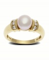 Sheer glamour in white on white. This ring design presents an 8mm cultured pearl offset by the brilliance of diamond. accents. Set in 14k gold.