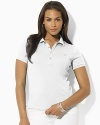 Designed for a trim, body-skimming fit in soft finely ribbed cotton, the iconic polo shirt receives a chic update with gleaming silver-tone metal buttons.