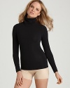 A classic turtleneck style with fabulous figure shaping powers from SPANX®.