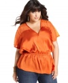 Getting standout style is a cinch with Baby Phat's plus size top, featuring embellished sleeves!