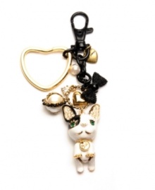 Haute dog. A chic canine adorns this bulldog key chain from Betsey Johnson. With sparkling crystal accents and an array of charms (including a glass pearl, a bow and heart motifs), it's crafted in gold tone mixed metal. Comes with a gift box. Approximate length: 4-3/4 inches.