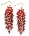 Red-y, set, go! Add a vibrant burst of color to your wardrobe with this chic cascade cluster earrings from c.A.K.e. by Ali Khan. Crafted in gold tone mixed metal, they feature a fashionable array of crystal and glass rondelle beads. Approximate length: 5/8 inches.