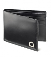 In fine Italian leather unsurpassed, Salvatore Ferragamo has created the Gancio billfold. A modern wallet with metal Gancini logo on front. Multiple card slots in the interior.