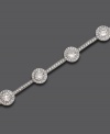 Delicate crystal accents are punctuated by gleaming round-cut cubic zirconia accents on this gorgeous silvertone mixed metal bracelet by Eliot Danori. Approximate length: 7 inches.