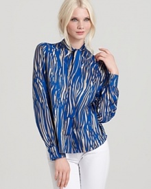 Vibrant blue zebra print decorates this sheer Rachel Zoe top for a infusion of the exotic into your every day. Brightening up your staple collection, this must-have is the investment of the season.