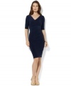 Rendered in fluid matte jersey, Lauren Ralph Lauren's chic three-quarter-sleeved dress is designed with a refined cowl neckline and gentle pleats at the hip for a flattering look.