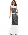 BCBGMAXAZRIA latest gown is decked out with a luxurious contrasting lace applique and a pop of peplum at the waist.