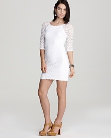 Work the season's white trend in this eyelet Aqua dress, sheer at the shoulders and sleeves for added femme. Complement the pale style with nude shoes and some serious bling.