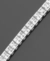 A beautiful tennis bracelet with a sophiticated air. The gorgeous princess-cut cubic zirconia (9 ct. t.w.) is set in sterling silver finished in platinum, by CRISLU. Approximate length: