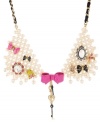 Chic creatures! A bird, a frog and a pig all stand out stylishly on Betsey Johnson's multi charm collar statement necklace. Embellished with bows galore, a key, an intertwined grosgrain ribbon, along with glass pearls and sparkling crystals, it's crafted in antique gold tone mixed metal. Approximate length: 18 inches + 3-inch extender.