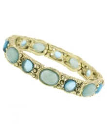 Slip on this antique-themed style for a unique vintage touch. 2028's glamorous bracelet features shimmery blue resin stones set in brass-plated mixed metal. Bracelet stretches to fit wrist. Approximate length: 7 inches.