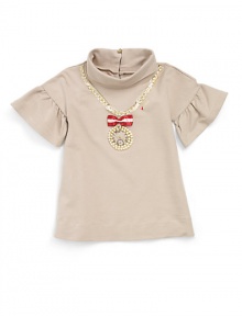 THE LOOKTurtleneckRhinestone and lace accents form a chain designFaux pearls and rhinestones form a pendant clockRibbon detail with padlockRuffled short sleevesTHE MATERIAL90% cotton/10% elastaneCARE & ORIGINHand washImported