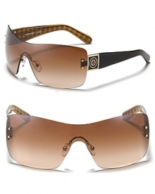 Protect your peepers while looking Tory Burch beautiful. These wrap-around shades are a striking choice.