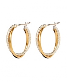 Chic hoops with double the versatility. Monet earrings feature gold tone and silver tone mixed metal twisted together into one stylish hoop. Approximate diameter: 7/8 inch.