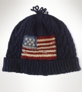 Constructed for a snug fit, a warm hat is rendered in a soft cotton blend with a knit flag at the front for a star-spangled finish.