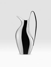 Crafted of highly polished stainless steel, this sleek style is an interpretation of one of the most iconic Georg Jensen silver holloware pitchers designed by Henning Koppel in the late 1940s. 13 H Imported