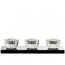 Accent your home with these beautiful votives from Baccarat. Black lacquer base adorned with 3 full-lead crystal votives.