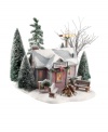 After an invigorating skating session, village residents gather for hot cups of cocoa and treats in this quaint warming house by Department 56. It features snow-dusted pines, benches around a fire, and outdoor lights for skating after dark.