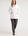 The perfect wear-everywhere piece, finished with side slash pockets and delicate gathered details.Shirt collarButton placket with gathered detailSide slash pocketsLong sleeves with button cuffsGathers at back yokeAbout 32 from shoulder to hem62% linen/36% viscose/2% spandexDry cleanImported of Italian fabric