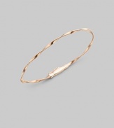 Simply stunning, this 18k rose gold bangle with delicate ridges and twists is great on its own, even better when stacked in multiples. 18k rose goldDiameter, about 2½Tongue-and-groove claspImported