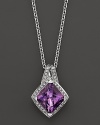 Pavé diamonds frame a glittering amethyst set in 18K white gold. 18K white gold chain.