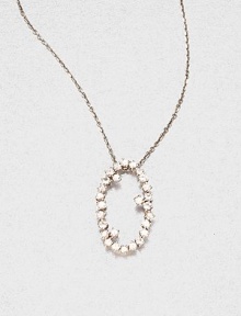 Sparkling white sapphires set in 14k white gold with a open oval design on a delicate link chain. White sapphire14k white goldLength, about 16Pendant size, about .6 Spring ring closureMade in USA