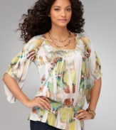 A tunic top with pizazz, from One World. The asymmetrical sleeves and peplum hem give it a unique look!