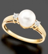 Accessorize with the beauty of the sea. This sparkling ring features cultured freshwater pearl (7 mm) and diamond accents set in 14k gold.