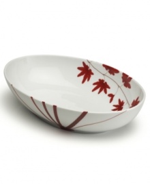 Vibrant red branches and leaves embellish this vegetable bowl inside and out. Its oval shape is ideal for everyday use while the modern, Asian-inspired design makes a festive addition to dinner parties.