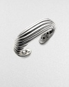 A sensuously curved fluted cuff of polished sterling silver is a fresh take on Yurman's signature cable. Sterling silver Diameter, about 2¼ Width, about 1 Imported