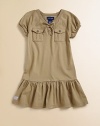 This drop-waist, cargo-inspired frock is the perfect mix of utility and girlie style.V-neck with lace-up frontShort puffed sleevesFront button placketButton-through bellows pocketsDrop-waist skirt with ruffled hemCottonMachine washImported Please note: Number of buttons may vary depending on size ordered. 