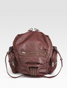 An extremely versatile design in super soft leather, adorned with exposed zippers for a hint of rock edge and a unique convertible backpack strap that unzips down the middle.Convertible backpack straps, 18 drop Shoulder strap, 15 drop Buckle drawstring snap top closure Six outside zip pockets One inside zip pocket Nickel hardware Nylon lining 15W X 13H X 3D Imported