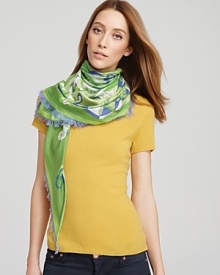 Swirling shapes and colorful flowers embellish a soft scarf from Emilio Pucci.