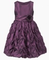 Lovely ruffles layered over the skirt of this rosette dress from Princess Faith give her glamorous look a lift.