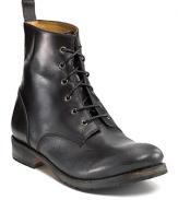 A refined military-style boot outfited with a smooth burnished leather toe, leather linings and a pull tab at the back.