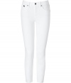 With a flattering fit and bright white stretch denim, Burberry Brits skinny jeans lend a crisp modern polish to every look - Classic five-pocket style with logo charm at hip, button closure, belt loops - Form-fitting - Wear with a brightly hued top and flats