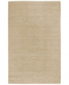 By using a centuries-old technique, craftsmen are able to produce the unique detail and texture of this plush wool rug from Surya's Mystique collection. They work traditional shuttles, then hand-carve and hand-finish the rug in pursuit of high quality and a flawless finish. Carved discs and spirals add subtle style to this elegant, versatile rug.